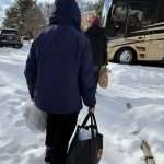 CORE Volunteers delivering food packages in the snow